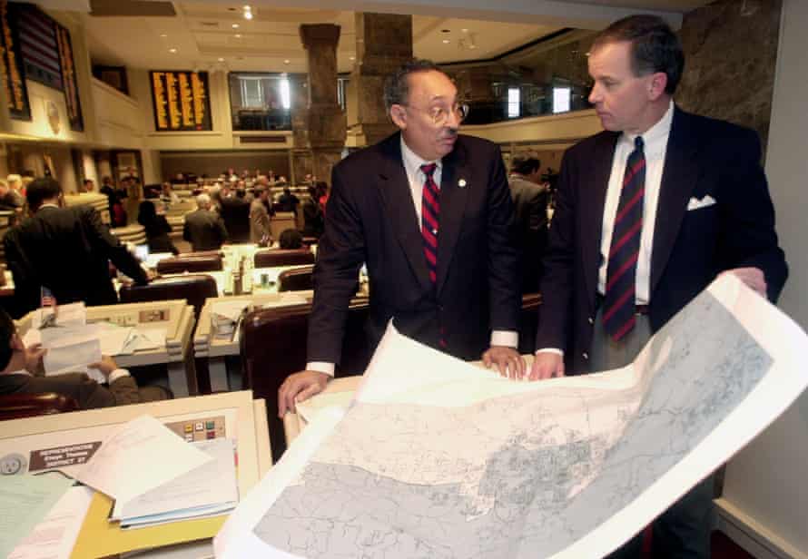 Alabama state Rep. Thad McClammy and Rep. Greg Wren look over a printed map of a congressional redistricting plan in January 2002.